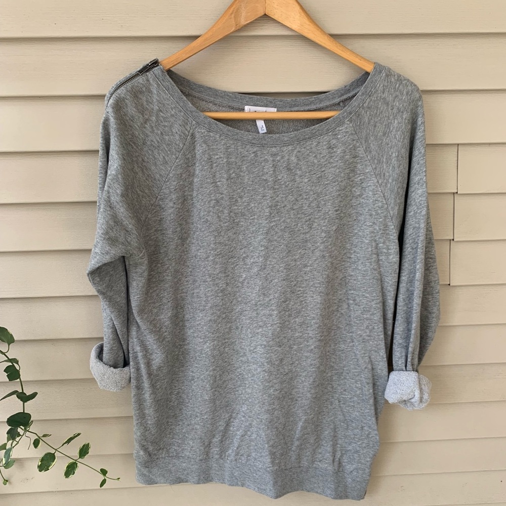 Soft sweatshirt-style top with zipper accents